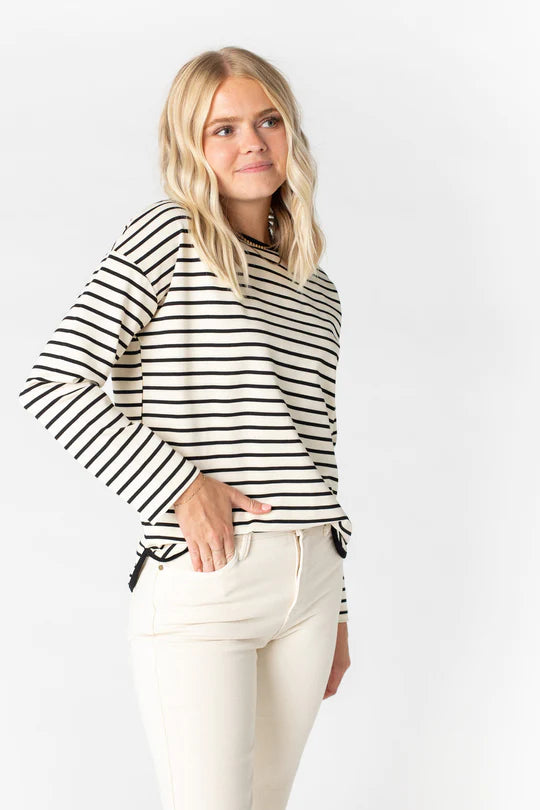 Elevate your wardrobe with the Isla Top, a luxurious blend of rayon, polyester, and spandex crafted to make a bold statement. Its dynamic stripes create a timeless fit, finished off with a modern round neckline and curved hemline.