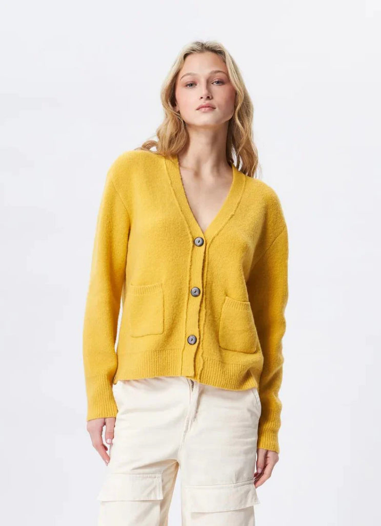 Discover luxurious comfort with the cozy Pierre Cardigan from John + Jenn. This oversized cardigan offers premium warmth and style for chilly days. Finished with patch pockets and 3-button closure, it's the perfect choice for seasonal layering.