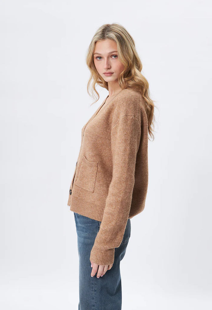 The Braxton is your go-to trendy cardigan stitch in a blended soft fabrication and neutral camel colorway. Features 2 patch pockets at the waist, 3 button closure, ribbed along cuffs and trim. The perfect mix of function and fashion, this piece is sure to become a staple in your wardrobe.