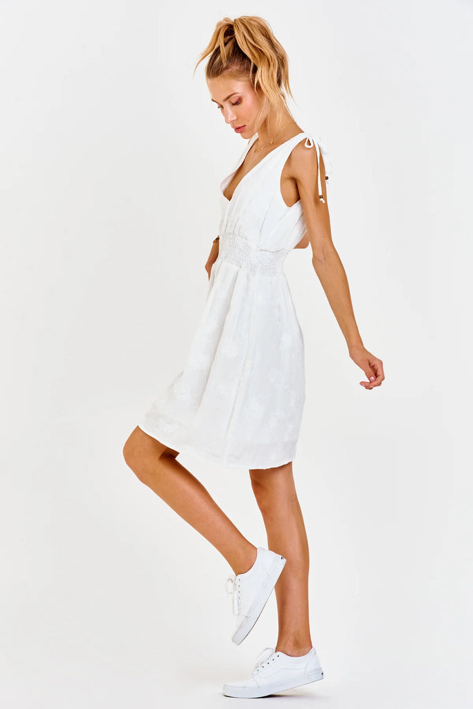 white sleeveless mid length dress