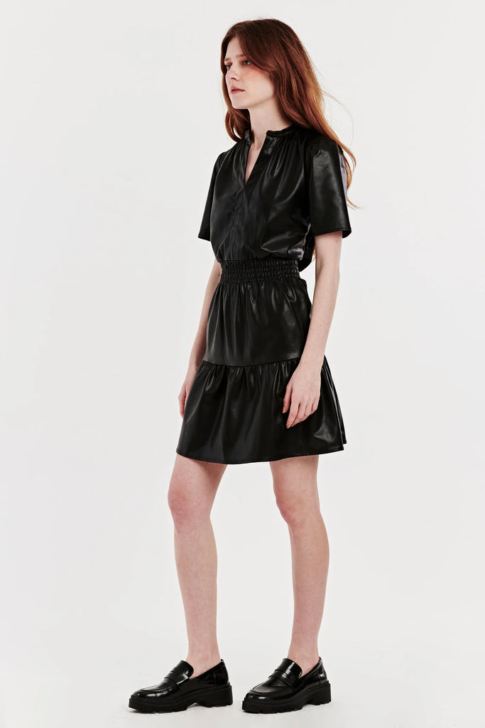 Smock Waist Dress in Black Vegan Leather on model side view