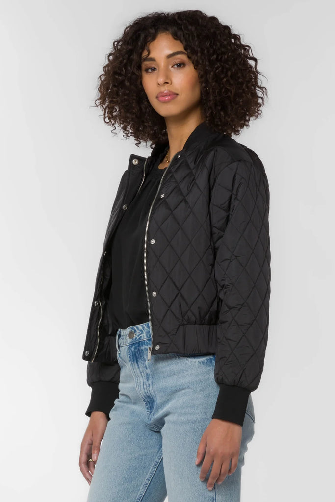 Our Sakura zip front plus snap front quilted bomber jacket features a ribbed collar and cuffs and side slash pockets.