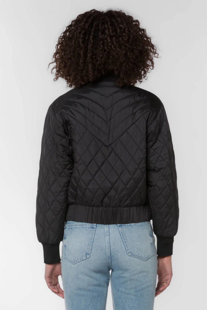Our Sakura zip front plus snap front quilted bomber jacket features a ribbed collar and cuffs and side slash pockets.
