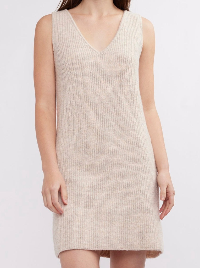 This super soft mini dress in a marled birch color and is as versatile as it is chic.  Wear with leather belt & blazer for dressed up vibe or layered over a dress or skirt and turtleneck.  Fit is true.