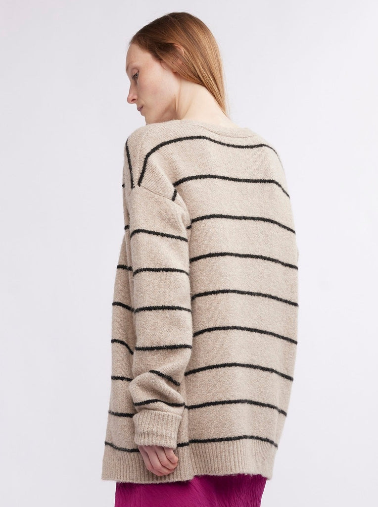 The Gia Stripe Cardigan from Self Contrast has an open front, drop shoulders, and placed stripes. You'll just love how the neutral color works with so many looks.