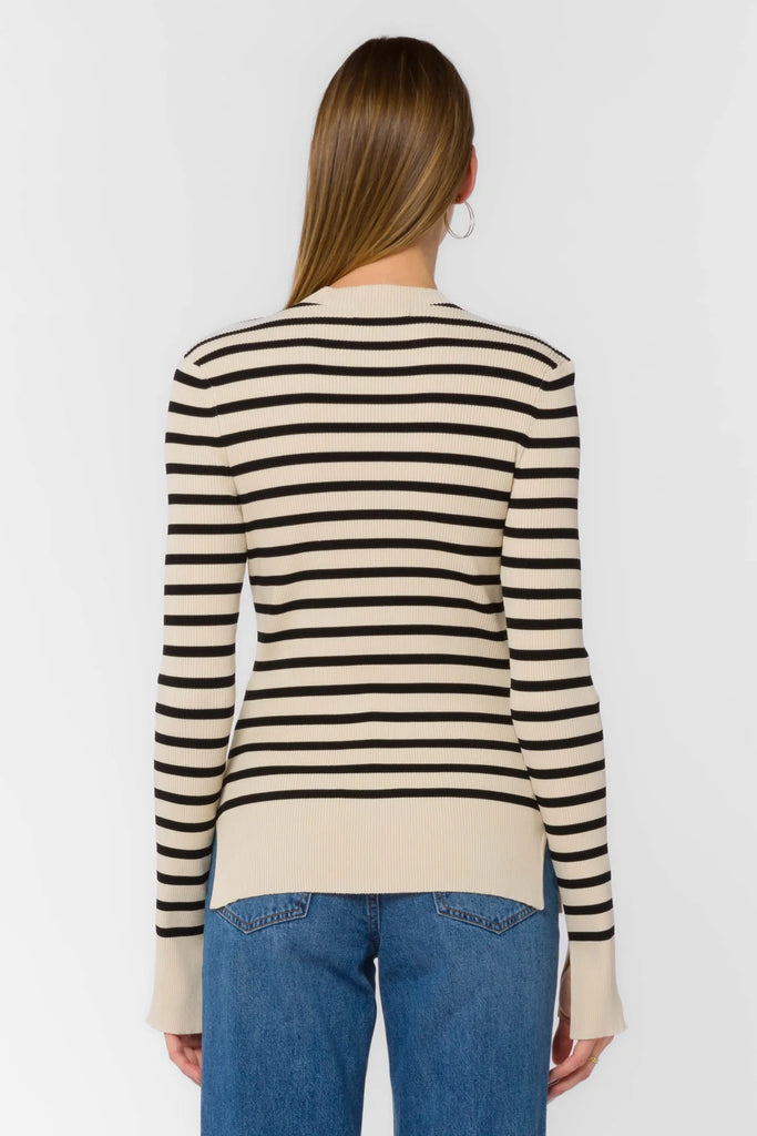 Our Teresa classic French striped sweater is the perfect addition to any wardrobe for a casual, yet trendy look. Featuring long sleeves with a slit ribbed cuff and hemline, in a timeless combination of black and ivory stripes.