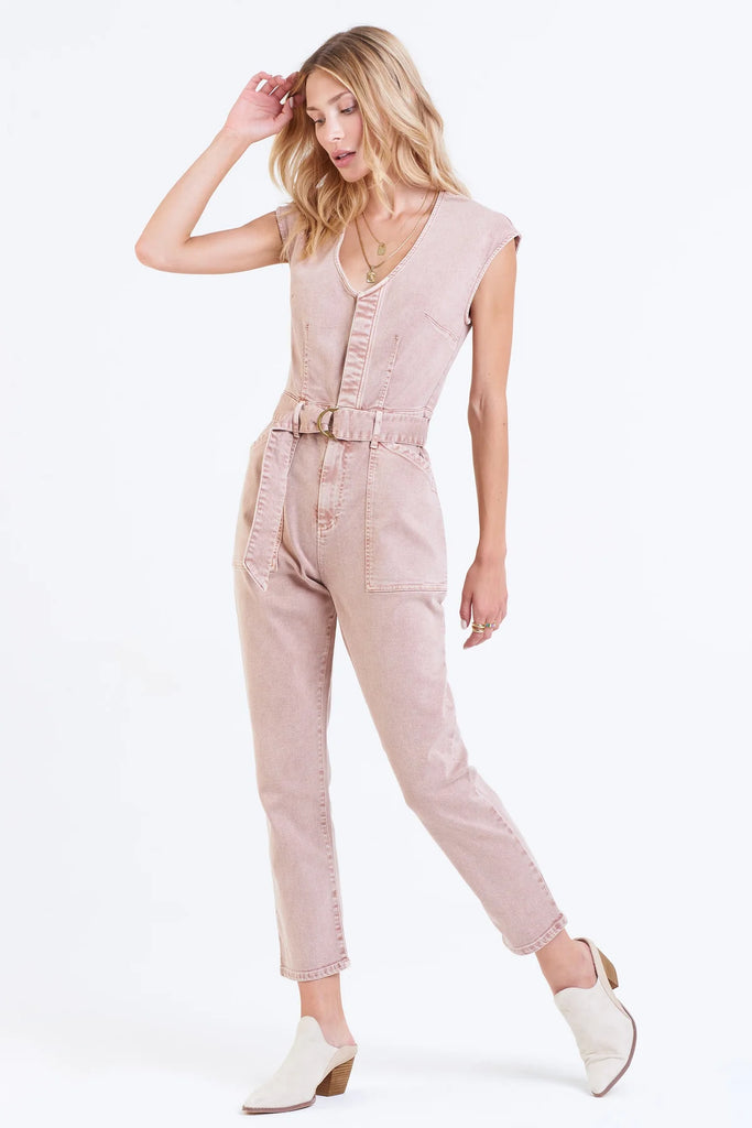 Women's Denim Jumpsuit. Nicole Color denim jumpsuit in rose dust color.  Cropped length with body darts for support, v-neck & sleeveless with hidden placket button front & utility cargo pockets.Fabric Content: 90% COTTON 8% POLYESTER 2% SPANDEX 