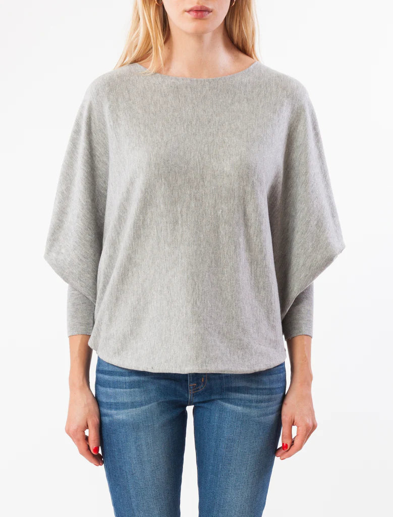 Women's Sweater in grey. Boat neck top with 3/4 length dolman sleeves and curved sweep. Fabric Content: 20% modal, 25% nylon, 30% polyester, 25% viscose
