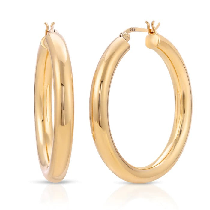 Gold Hoop Earrings. Gigi Hoop Earring. These standout tubular hoops are a must have. 14K Gold Plated 40mm diameter