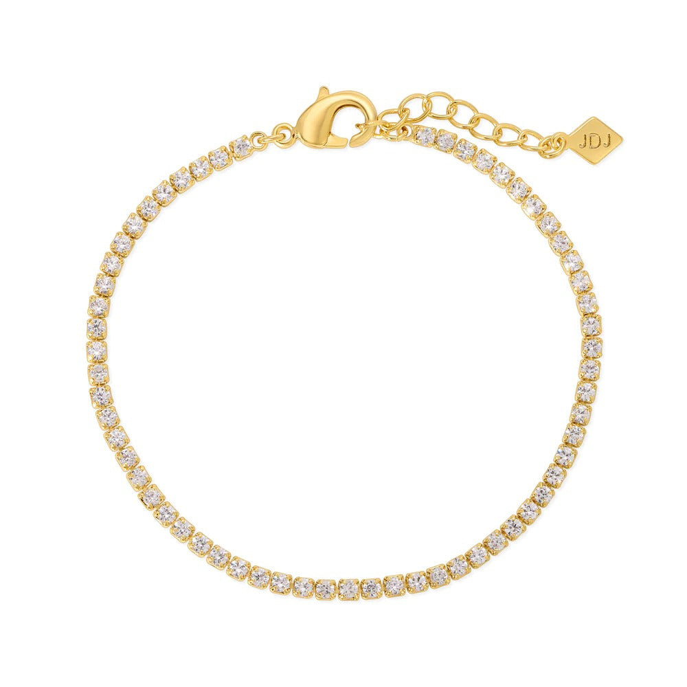 Simple and perfect at the same time! Add this 2mm cz tennis bracelet to any of your stacks for extra shine. 6.5" with a 1" extender 14k Gold plating over brass