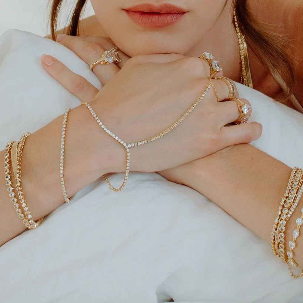 Lookin Fine Bracelet in gold. Simple and perfect at the same time! Add this gorgeous bracelet to any of your stacks for extra shine. 7 Inches 14k Gold plating over brass