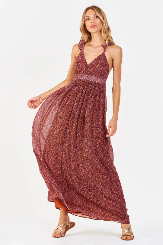 Women's Maxi Dress. Elia halter maxi dress in Terracotta palm color.  Deep overlap v-neck with petal cross back straps & empire waist finished in contemporary palm print. Fabric Content: 100% Polyester