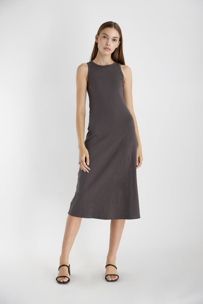 The Ivette Dress in Charcoal. The Ivette Dress is a ribbed knit fit and flare dress. Form fitting at the top, this dress falls from the hips with ease, creating smooth lines that move with your body. Fabric Content: 95% Cotton, 5% Spandex