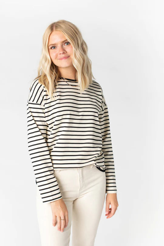Elevate your wardrobe with the Isla Top, a luxurious blend of rayon, polyester, and spandex crafted to make a bold statement. Its dynamic stripes create a timeless fit, finished off with a modern round neckline and curved hemline.