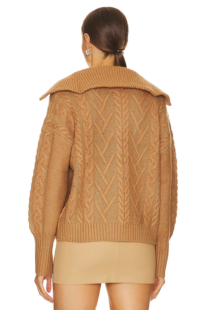 A must-have staple sweater, this cozy-chic caramel color pullover features a relaxed silhouette with a quarter-zip neckline, cable stitching, and rib knit trim. Layer over your favorite top as a sweater jacket. You'll be wearing it all season long with jeans, leggings, and trousers.