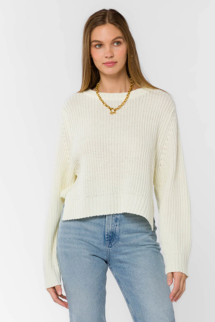 Meet your next favorite knitwear—equally cozy and warm. This long sleeve crewneck sweater features side slits at the hem, and ribbed hem cuffs and neckline. 