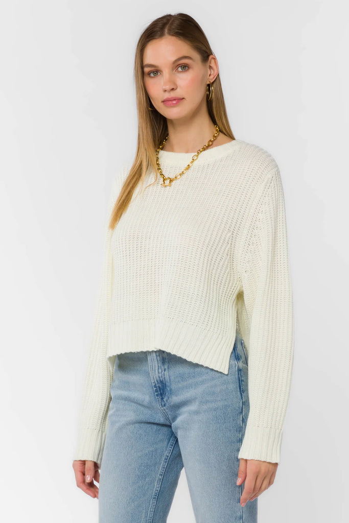 Meet your next favorite knitwear—equally cozy and warm. This long sleeve crewneck sweater features side slits at the hem, and ribbed hem cuffs and neckline. 