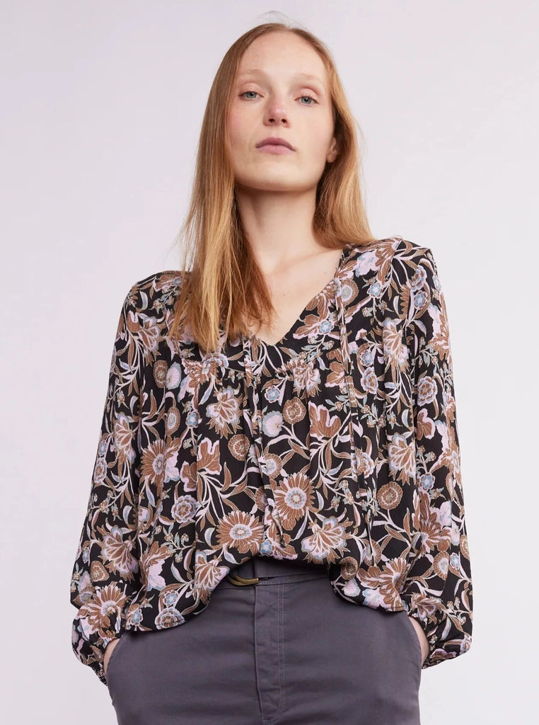 This luxurious Magnolia blouse boasts an ethereal open V design, with flowy and lightweight fabric. The perfect choice for any special occasion, its airy texture will keep you looking and feeling cool and confident.