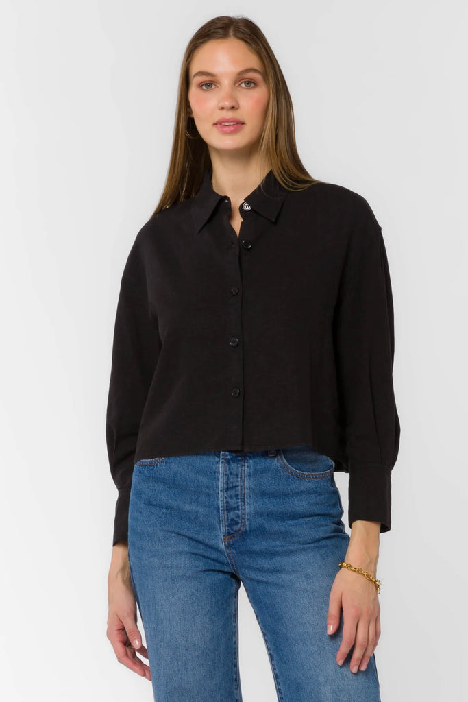 This Summerlyn Shirt adds a timeless style to your wardrobe. Featuring a button-up and long cuffed sleeves, this shirt keeps you looking sharp and professional. It also has a cropped collar, giving you a touch of modern sophistication.