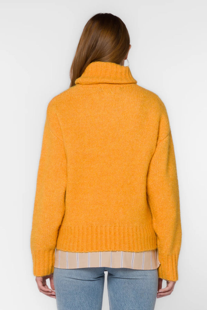 The Tillie Sweater in marled orange is the perfect addition to your wardrobe this season. Crafted with long sleeves, a turtleneck, drop shoulder and ribbed cuff and hem, this sweater will keep you warm and stylish throughout the cold months. 