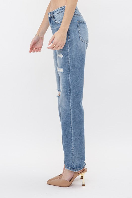 Rigid High Rise 90s Straight. Look trendy and fun in this straight fit jeans with ripped and distressed details.Fabric Content: 100% Cotton
