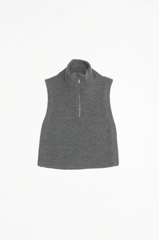 Women's Renn vest in heather grey. The Renn Vest features a high neck with half zip closure, that opens to a feature collar. With a relaxed fit and neutral colorway, this vest offers versatile styling options to wear as a stand-alone piece or layer with a soft long sleeve. Fabric Content: 60% Acrylic, 40% Nylon