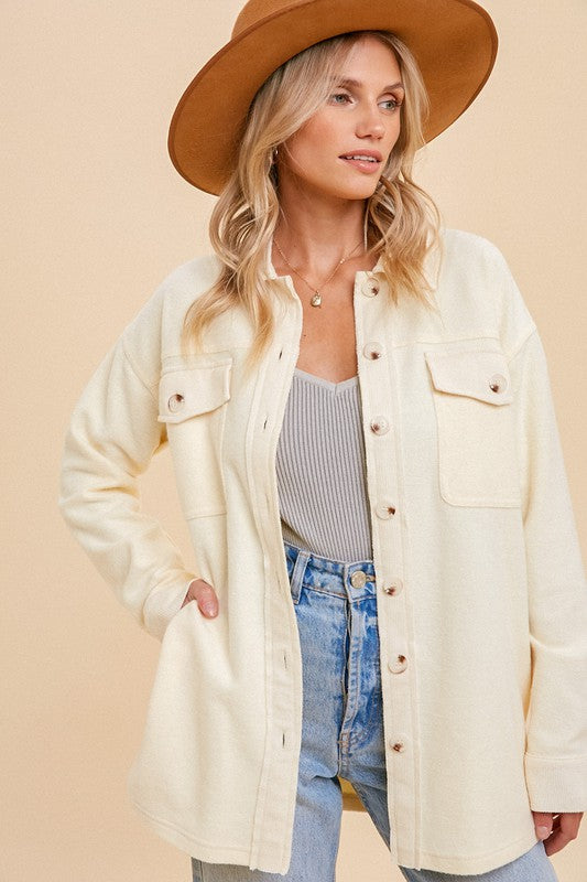 Women's Shacket in vanilla cream color. SOFT BRUSHED EASY EVERYDAY WEAR BUTTON DOWN SHACKET Fabric Content: 85% COTTON 15% POLYESTER CONTRAST:64% COTTON 30% POLYESTER 6% SPANDEX