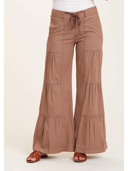Terraced Wide Leg Pant in brown. It's back by popular demand: our signature terraced ruched wide leg pant, with a flat drawstring waist, back elastic, zip fly and side seam pockets. Fabric Content: Stretch Poplin: 96/4 Cotton/Spandex