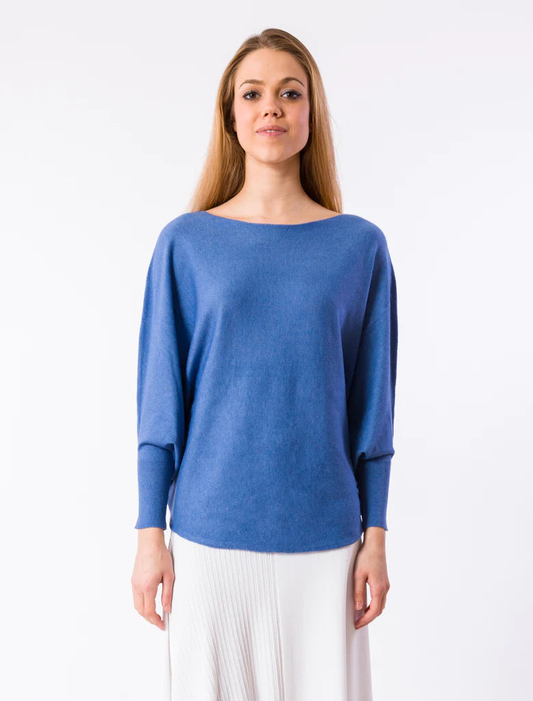 Women's Sweater in blue. Boat neck top with 3/4 length dolman sleeves and curved sweep. Fabric Content: 20% modal, 25% nylon, 30% polyester, 25% viscose 