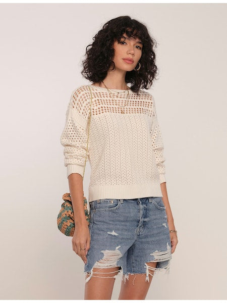 Women's Sweater. The Moore Sweater in eggshell color is the perfect sweater for warm weather. It has a relaxed fit and has an open-=-stitch crochet detail along the shoulders. Pair it with a pair of jeans for an everyday look. Fabric Content: 55% Acrylic, 45% Cotton