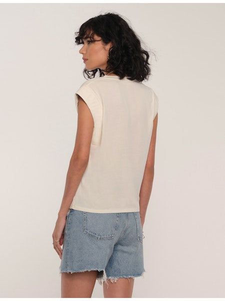 Women's Tee. Irina Tee in ivory color. The Irina Tee does the effortless-meets-polished thing so well. This soft crew neck tee faux leather detailing along the sleeves. Pair it with cut-offs or jeans for a perfect model-off-duty look. Fabric Content: 80% Cotton, 20% Polyester