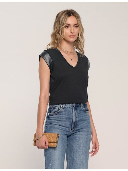 Women's Tee. Irina Tee in black color. The Irina Tee does the effortless-meets-polished thing so well. This soft crew neck tee faux leather detailing along the sleeves. Pair it with cut-offs or jeans for a perfect model-off-duty look. Fabric Content: 80% Cotton, 20% Polyester