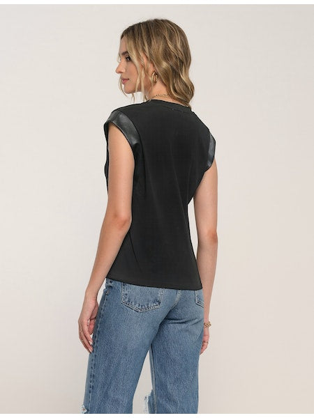 Women's Tee. Irina Tee in black color. The Irina Tee does the effortless-meets-polished thing so well. This soft crew neck tee faux leather detailing along the sleeves. Pair it with cut-offs or jeans for a perfect model-off-duty look. Fabric Content: 80% Cotton, 20% Polyester