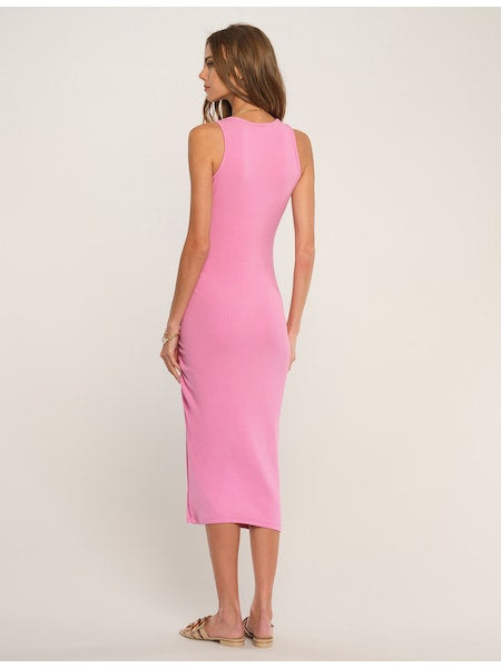 Women's Pink Dress. Perla dress in pink. Our Perla Dress is a warm weather classic. Made of our ultra-soft ribbed knit, it contours and molds to the body perfectly while showing a bit of skin thanks to its scoop neckline and side slit. Fabric Content: 60% Cotton, 32% Rayon, 8% Spandex