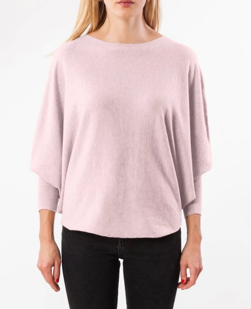 Women's Sweater in pink. Boat neck top with 3/4 length dolman sleeves and curved sweep. Fabric Content: 20% modal, 25% nylon, 30% polyester, 25% viscose